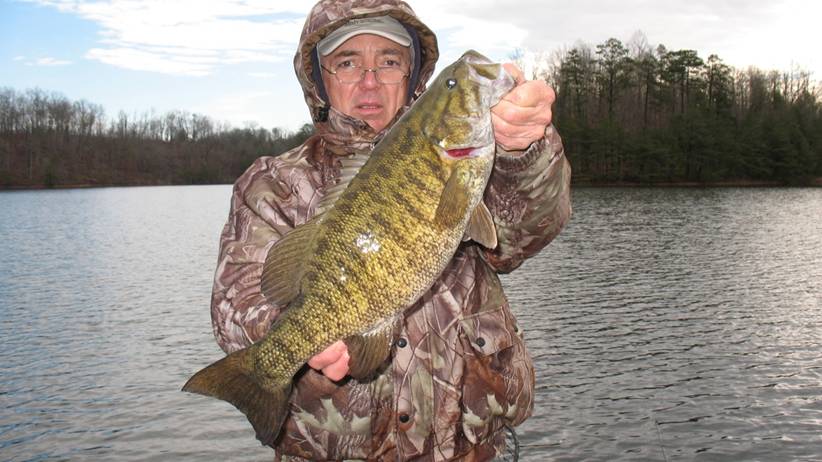 John Southern holds a massive smallmouth bass he caught